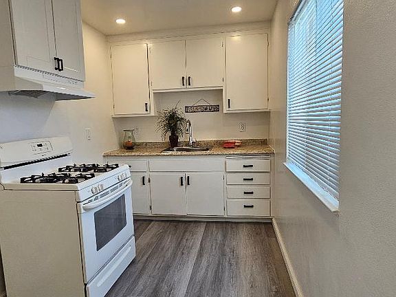 kitchen, new overhead lighting, new blinds, all new electrical and fixtures.