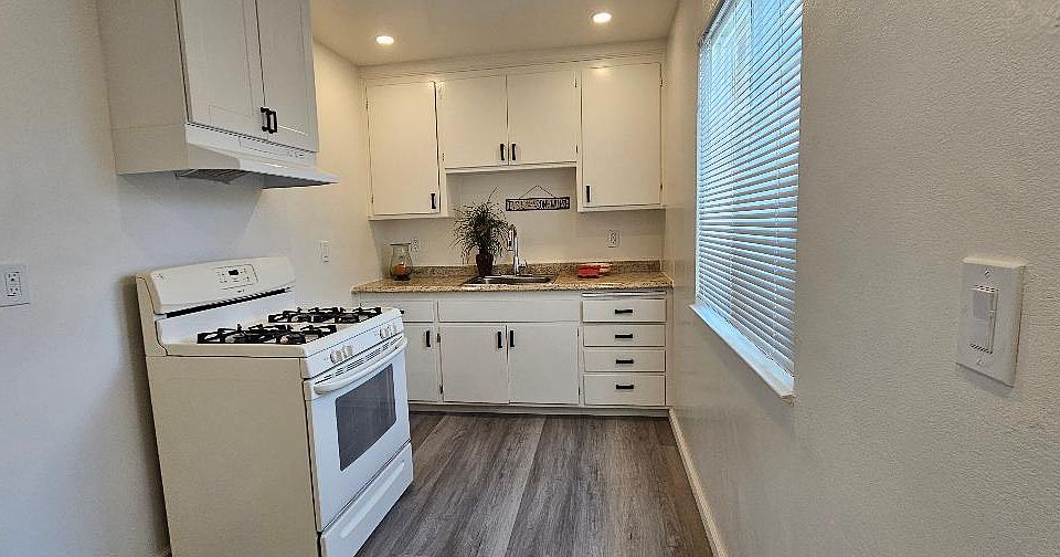 kitchen, new overhead lighting, new blinds, all new electrical and fixtures.