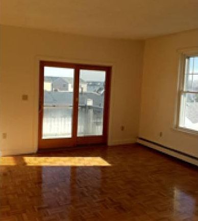 Living room slider to deck; sunny and high ceiling