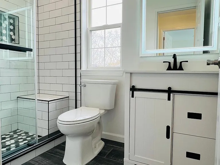 New Guest Bathroom in Hallway - shows seated bench for shower