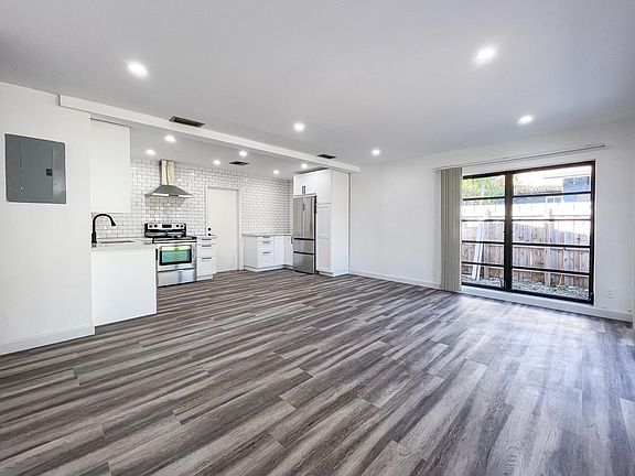 Open floor plan with spacious kitchen and living room.