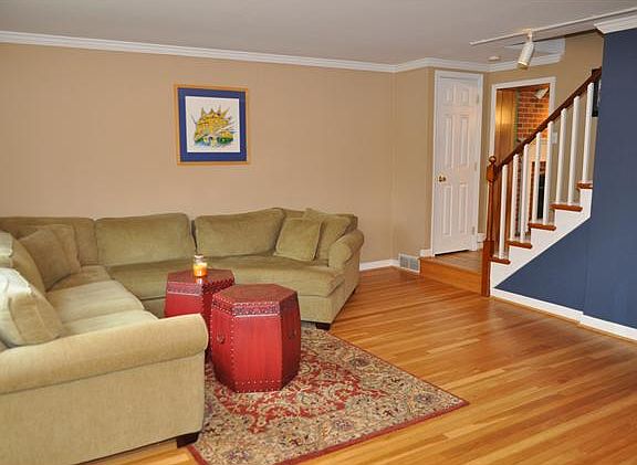 Living room view looking at stairs & doorway to FR