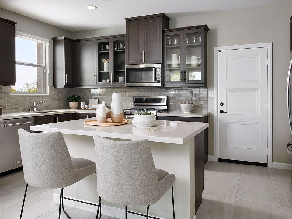Residence 3 at Indigo at Canvas Park Kitchen with Dark-Wood Cabinets