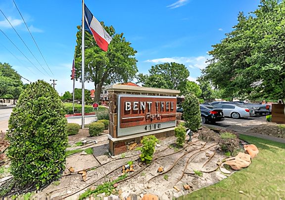 Welcoming monument sign with professional landscaping at the entrance of the community.