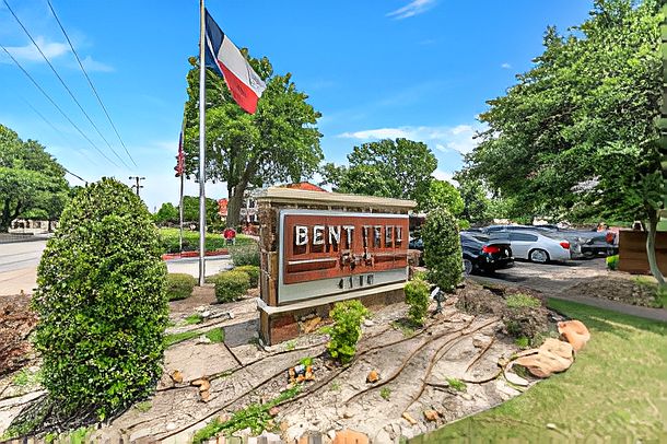 Welcoming monument sign with professional landscaping at the entrance of the community.