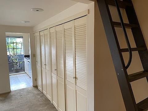 from entryway through kitchen to deck