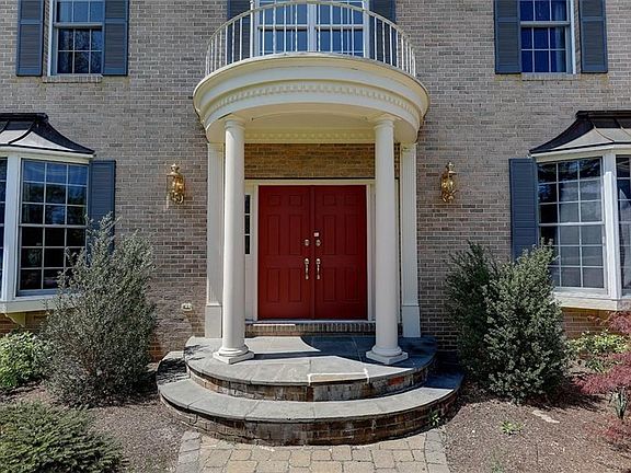 Circular Portico. Brick front with Brick Quoined Corners