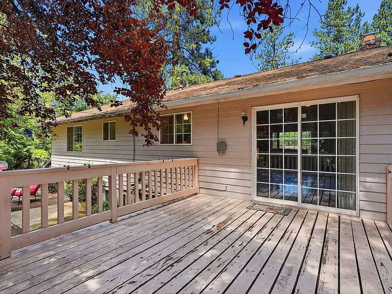 large deck off the dining room makes a peaceful 2nd dining room and social space all summer
