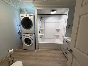 Full Bath w/ Stacked Washer & Dryer that come with the unit! Bathroom was remodeled within the last year