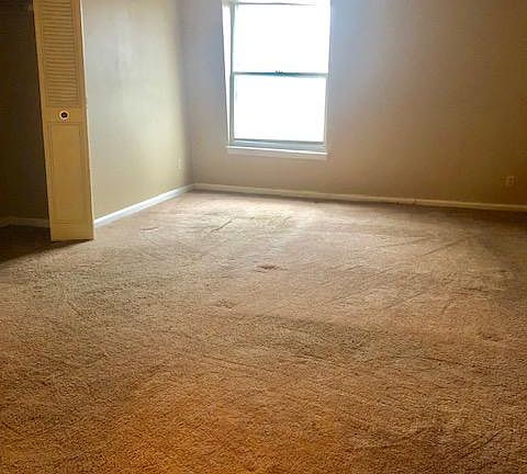 Master bedroom with large window