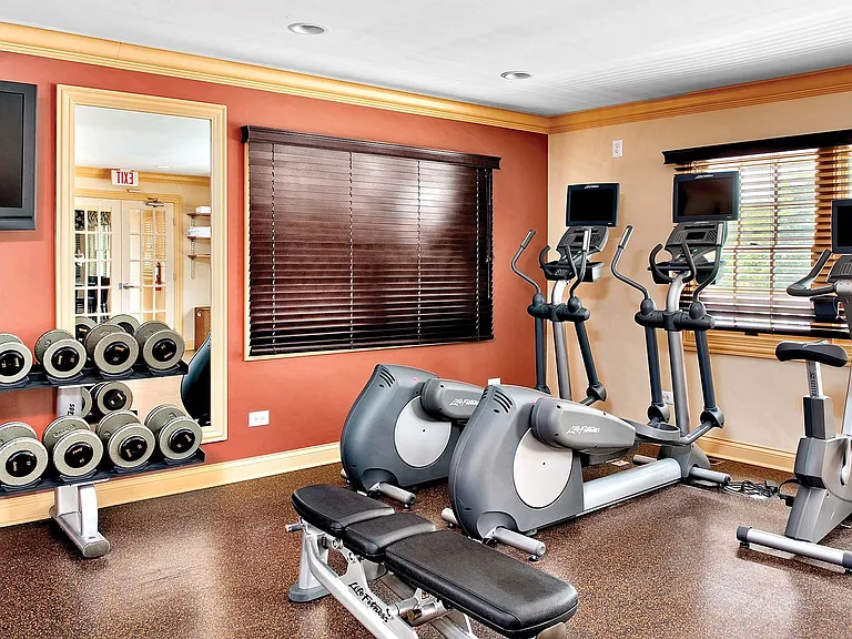 Fitness center has free weights and cardio machines
