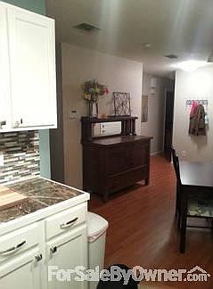 Living room
						:
						Custom built entertainment and bookshelves.