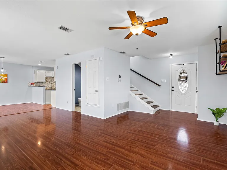 A view from the living room showing the open downstairs floorplan.