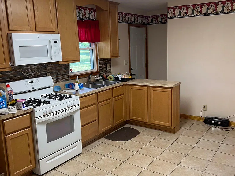 Kitchen looking towards back door & basement door