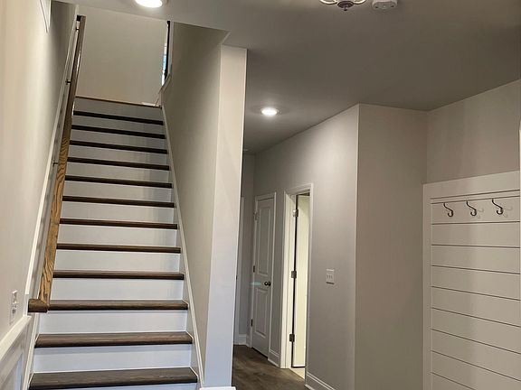 Open and welcoming foyer with all wood landing area.