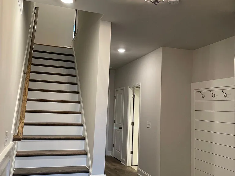 Open and welcoming foyer with all wood landing area.