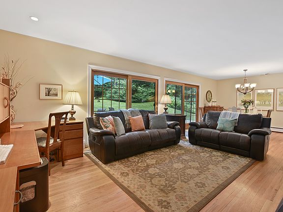 Inviting spacious living room with wood flooring