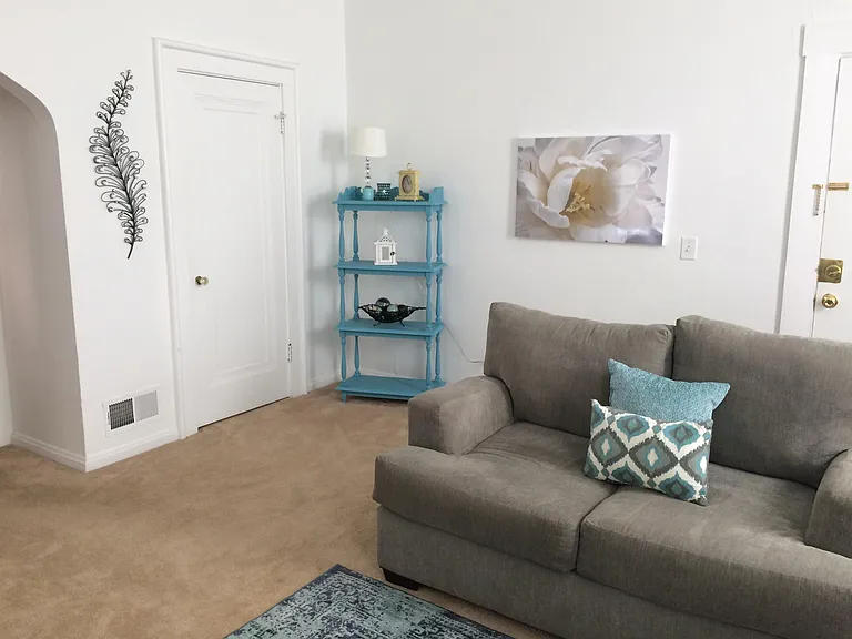 The living room. Large, high ceilings, plenty of natural light.