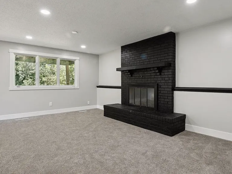 Basement family room with walkout and fireplace