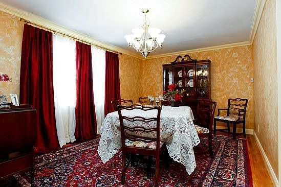 View of dining room from front hall with custom wall coverings