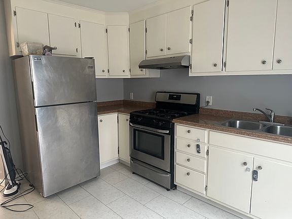 Kitchen with stainless steel appliances.