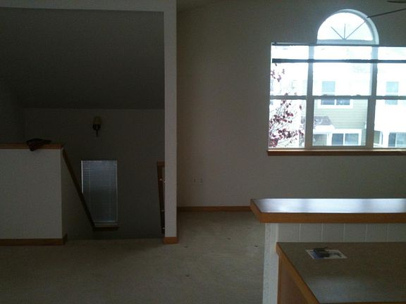 large living area with large windows and lots of light