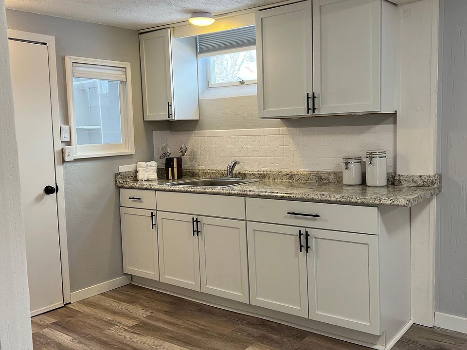 New cabinets, counter & sink with new faux-wood vinyl flooring. 12_x8_