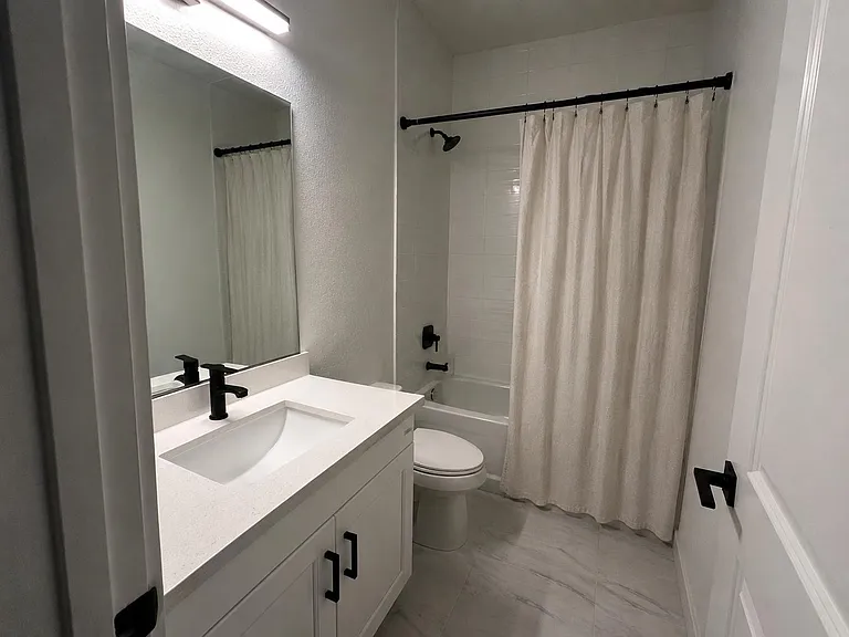 Private and well equipped bathroom with soaking tub and deep sink.