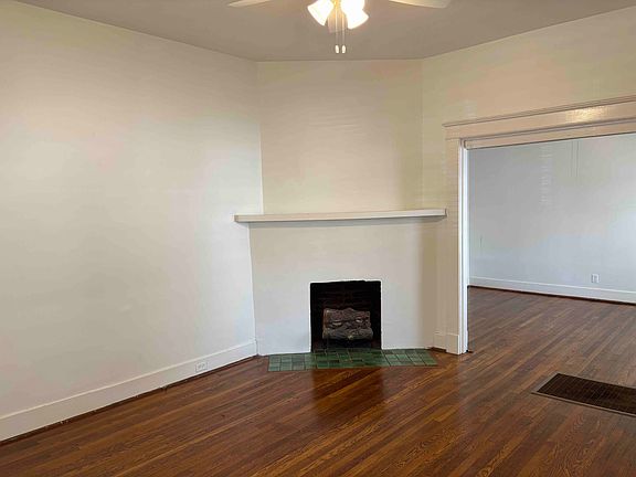 View of the living room. Fireplace is decorative.