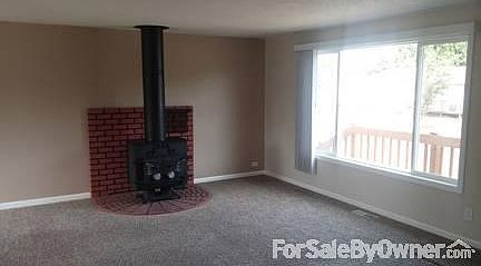 Living Room
						:
						Wood stove provides plenty of heat to warm the house.