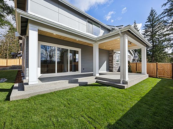 Covered outdoor living and nice-sized yard