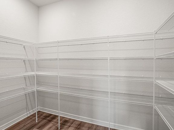 A walk-in pantry provides storage convenience - Everly by Highland Homes
