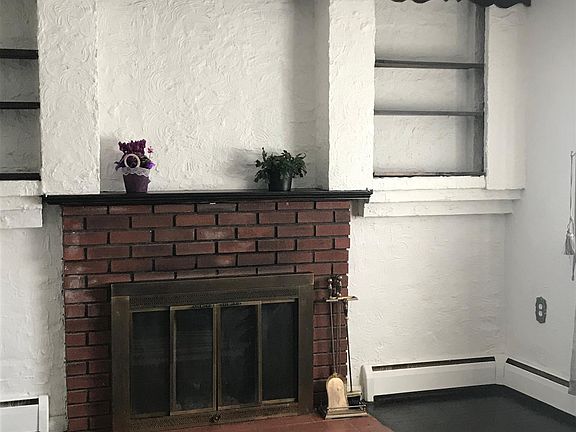 Living room fireplace; built in shelves with lighting