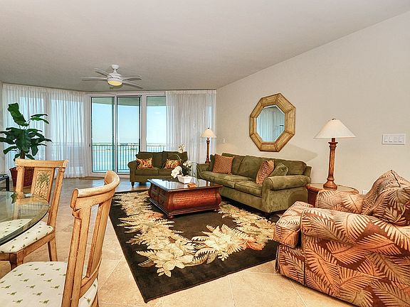 Living room opens to large balcony