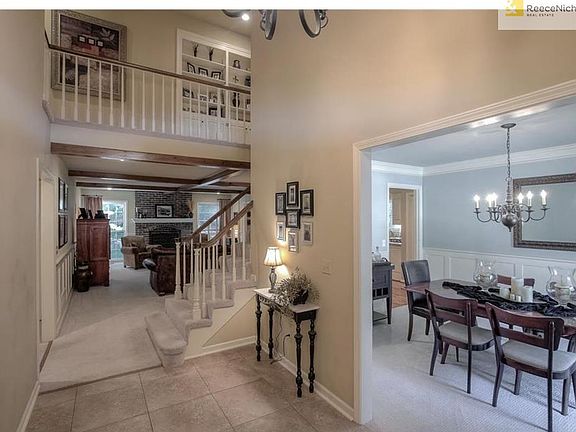 Formal dining room with gorgeous finishings & updated wainscotting! Entry leads to your spacious Great Room!