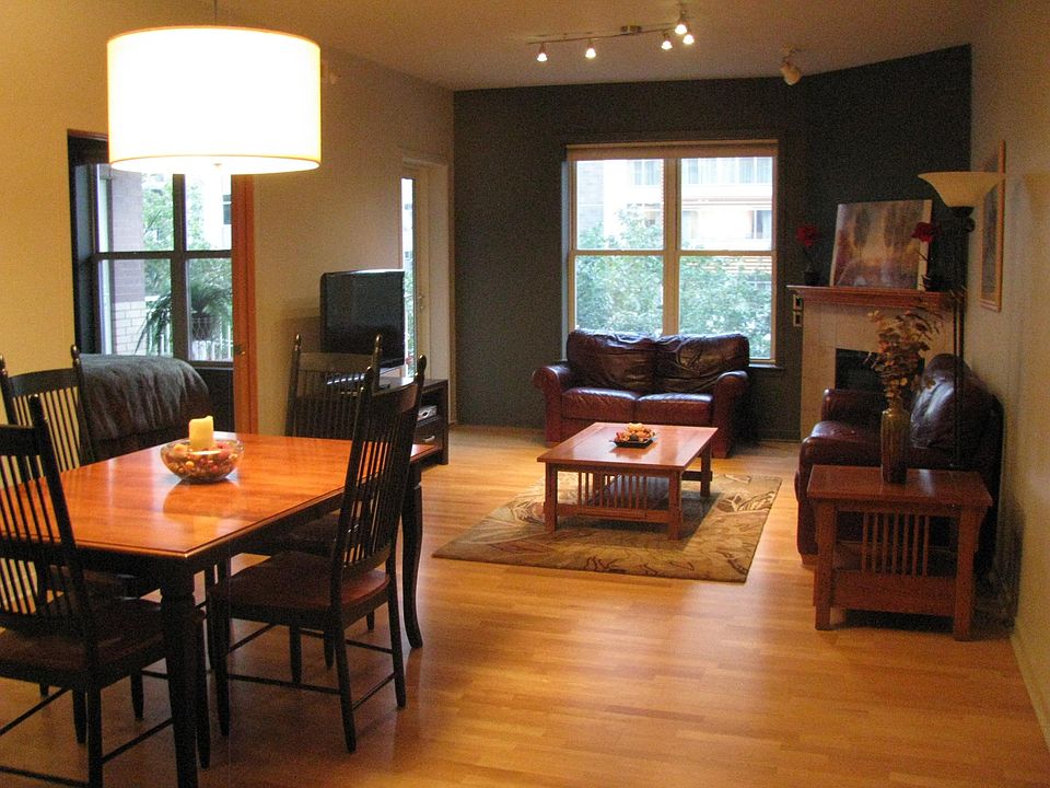 Large open great room with dining area and gas fireplace