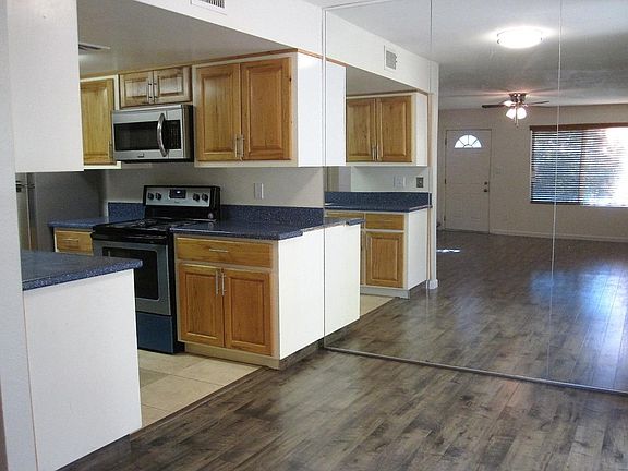 Dining kitchen area with wall mirrors