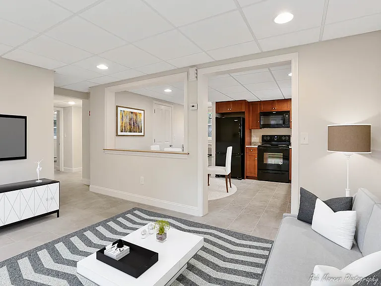Living room and kitchen virtually staged.