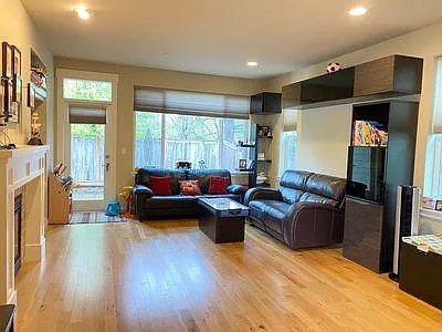 as you move past the dinning area, you will enter the kitchen and then see the cozy & warm family room with a fire place & TV console.