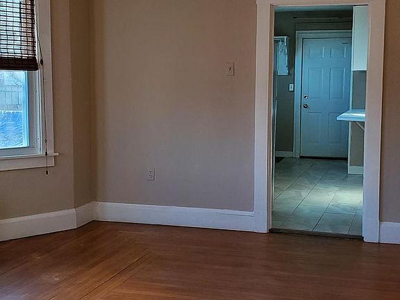 Large Living Room Bay Windows View towards kitchen