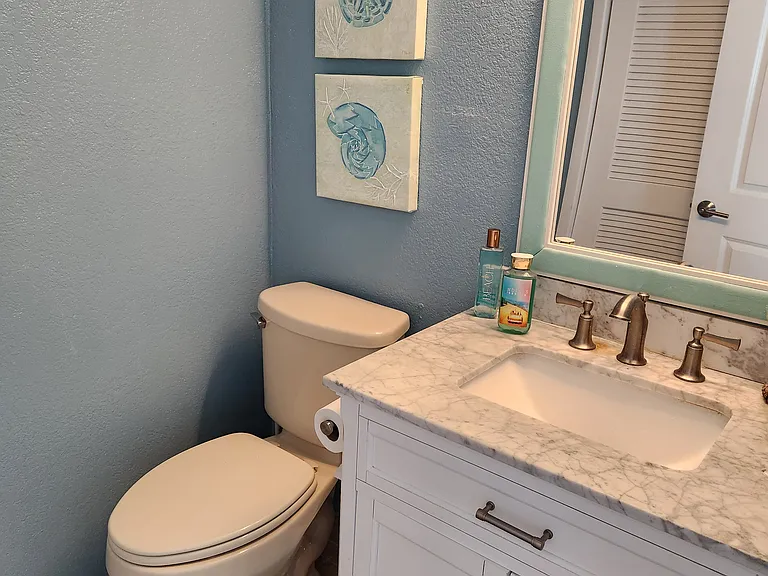Half Bathroom upstairs across from laundry area