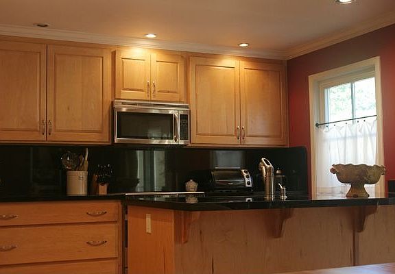 Kitchen has lots of upgrades including stone counters and upgraded cabinets