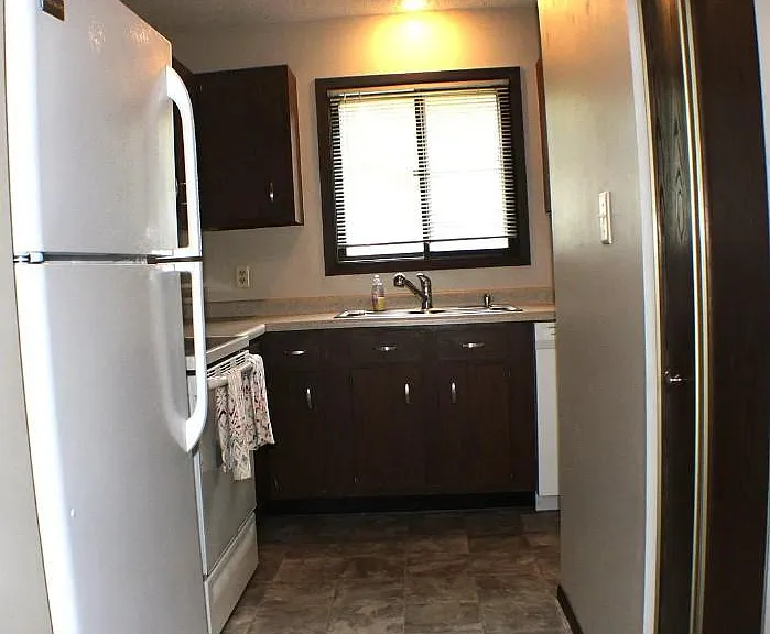 Kitchen from living/dining room opening.