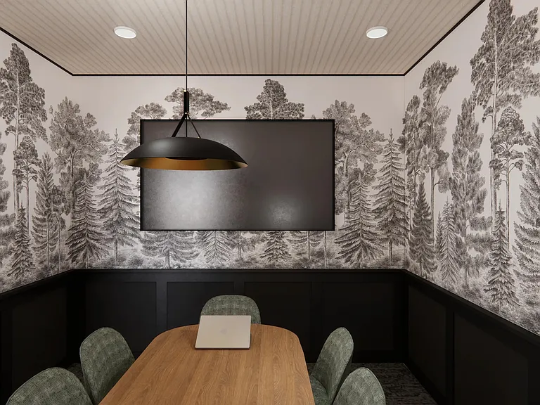 The private conference room at Modera Bridle Trails offers a polished setting for meetings, focus time, and collaboration.
