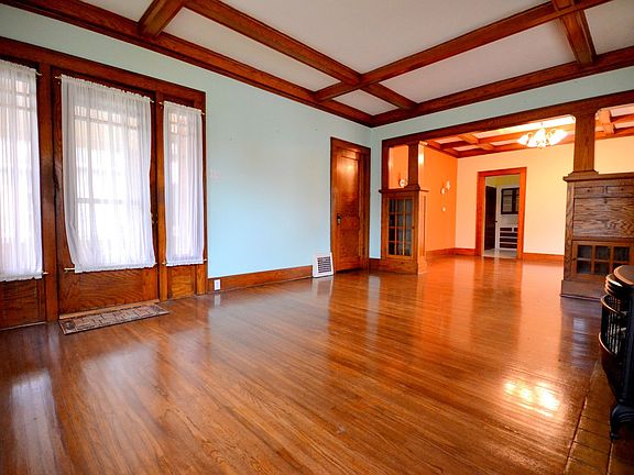 Living room with dining room with fireplace and bedroom off the living room