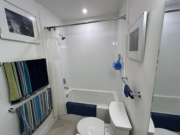 Bathroom has deep soaking tub.