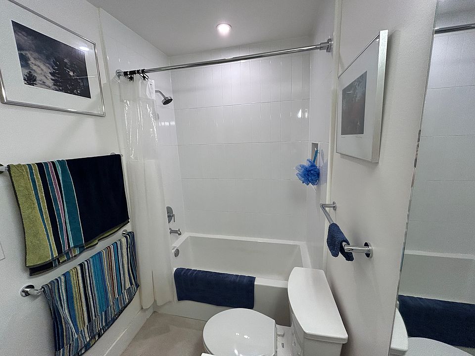 Bathroom has deep soaking tub.