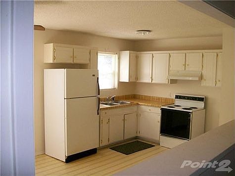 Huge kitchen with fridge and stove included. Lots of room for the family and friends to sit down for