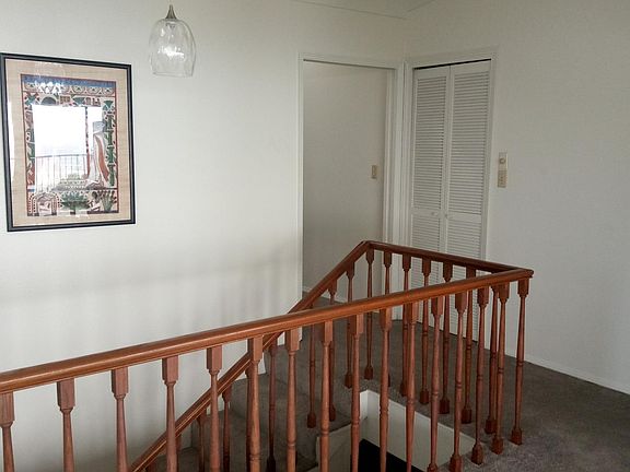 Entry with new gray carpeting.