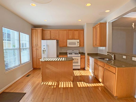 Lots of cabinets, pantry, and island make for a highly functional kitchen